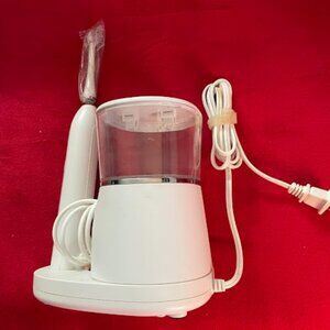 WaterPik tooth flosser/toothbrush. $12